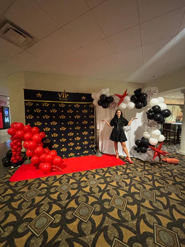 Red, black and white VIP red carpet balloon installation for a corporate event in the KC metro